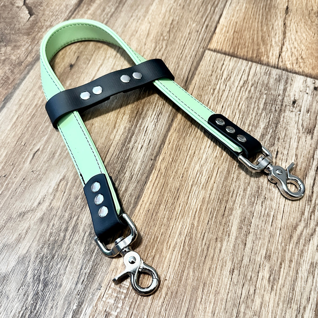 Semi-Rigid Handle / 11.5” down one side/ Pastel Green and Black / Silver Trigger Snaps